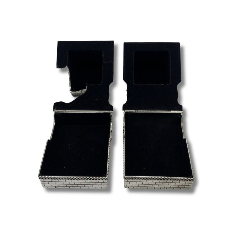 inside view of silver tefillin boxes showcasing interior detail and unique architectural style