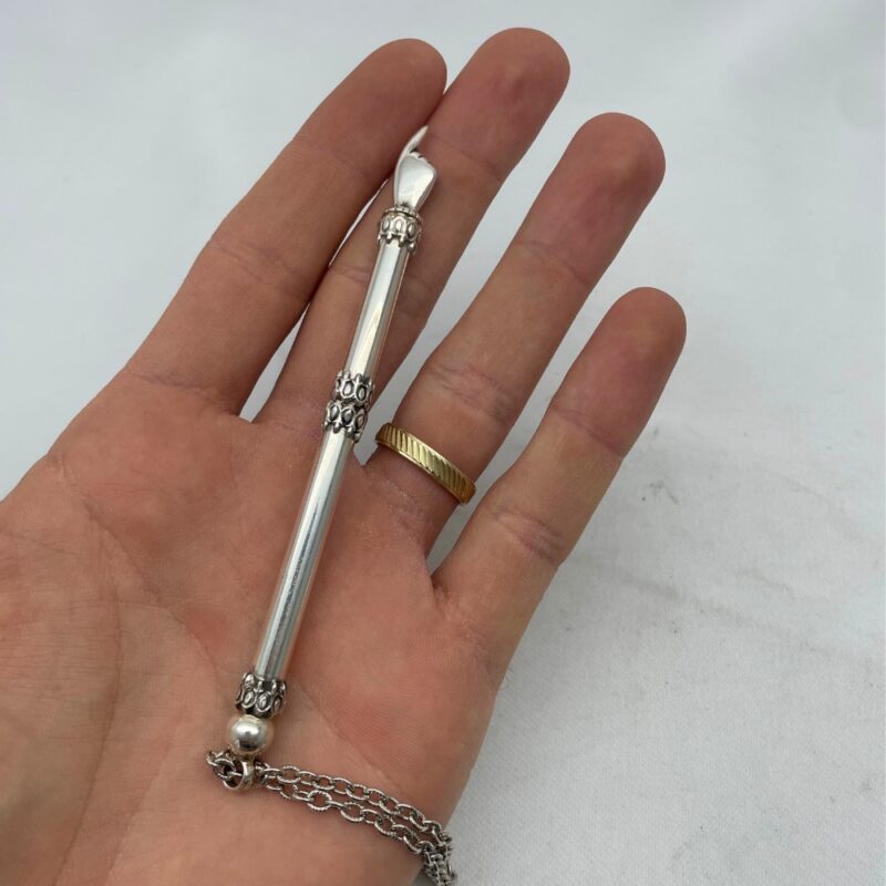Sterling silver small Torah pointer with chain displayed on hand