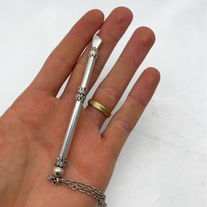 Sterling silver small Torah pointer with chain displayed on hand