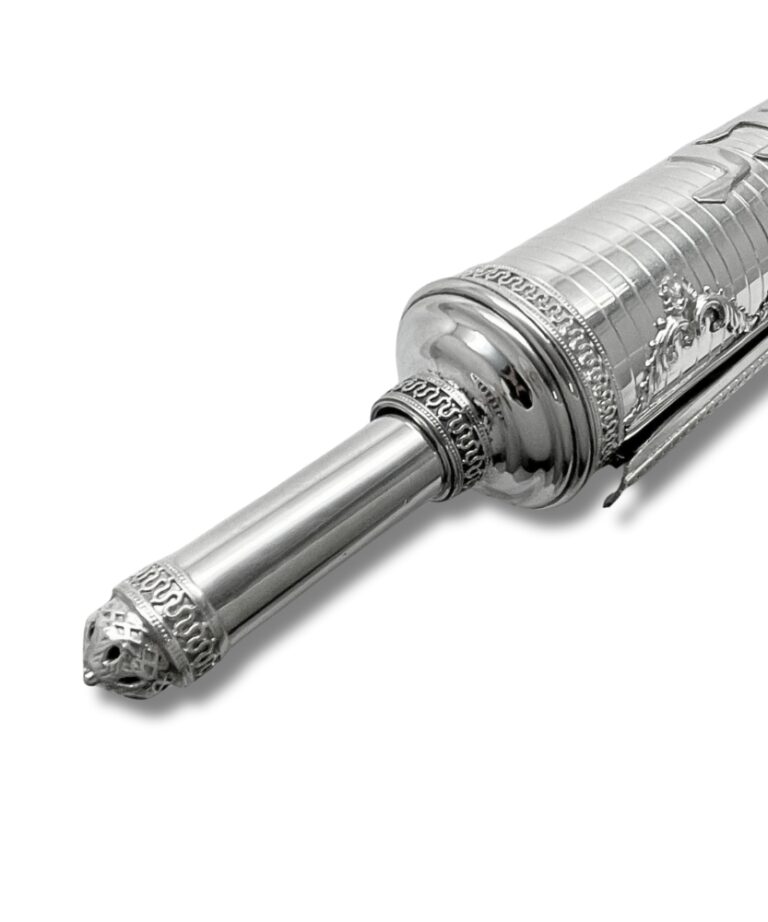 Rotating handle of a large silver scroll case for Megillat Esther