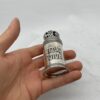Small Judaica scroll case held in hand to show scale and craftsmanship