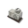 Detailed view of a silver charity box with arched windows and a rounded lid
