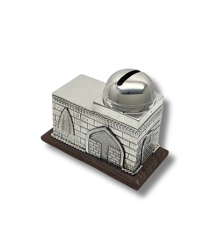 Detailed view of a silver charity box with arched windows and a rounded lid