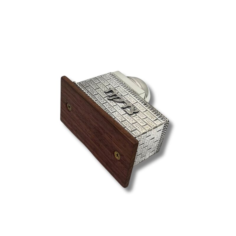 Hand holding a handcrafted Sterling Silver Tzedakah Box with wood base