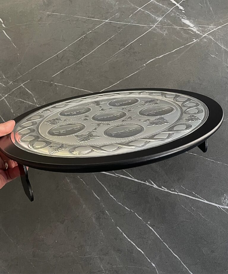 Side view of the 925 Silver Passover Seder Plate showing the engraved surface and black wood base