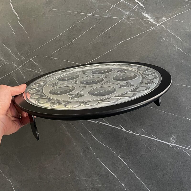 Side view of the 925 Silver Passover Seder Plate showing the engraved surface and black wood base
