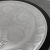 Close-up of the engraved Charoset, Z’roa and Beitzah sections with floral decorations on the Seder plate