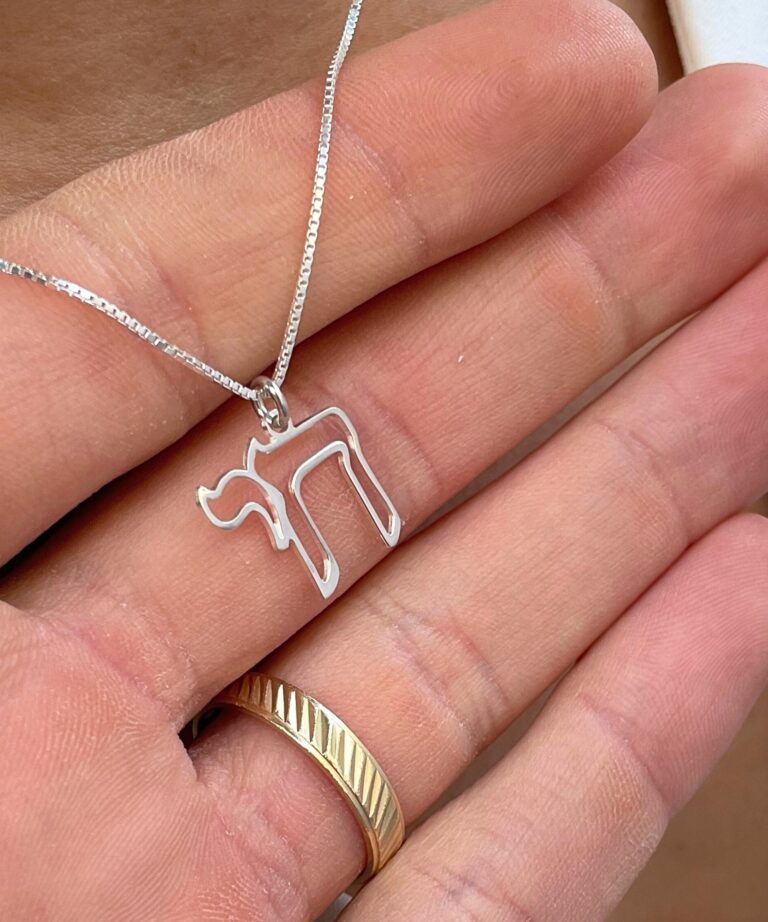14K White Gold Chai outline pendant necklace held in hand