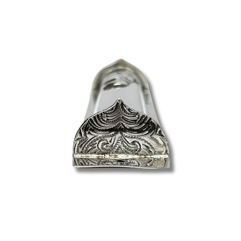 Bottom view of the mezuzah case highlighting the engraved filigree pattern at the decorative base