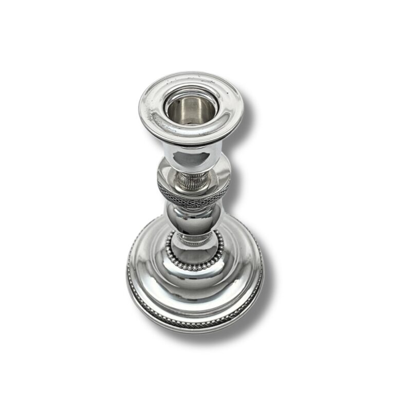 Top view of silver Havdalah candle holder showing the candle opening and ornate design