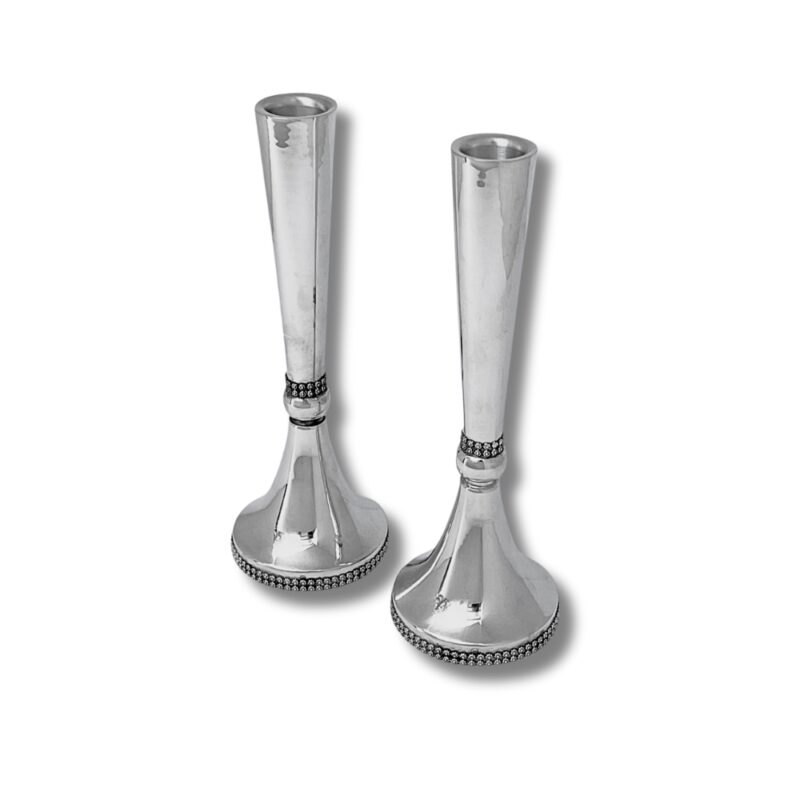 Front view of two large sterling silver candlesticks with filigree design, standing upright