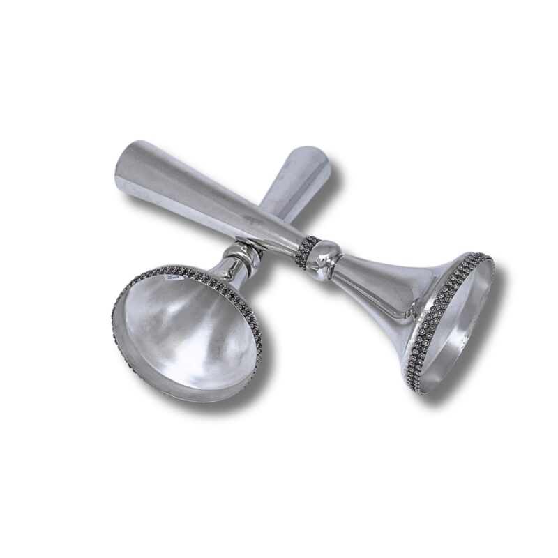 Bottom angle view of the candlesticks lying down, highlighting polished interior and filigree detail
