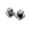 Angled view of two sterling silver tefillin boxes with detailed openings shaped for the tefillin placement