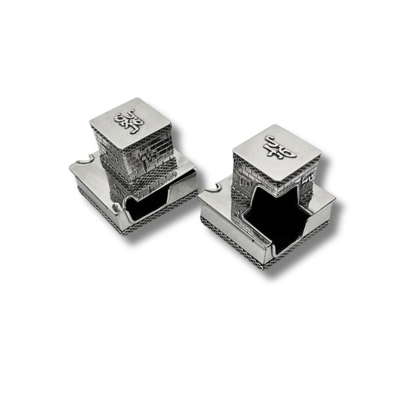 Angled view of two sterling silver tefillin boxes with detailed openings shaped for the tefillin placement