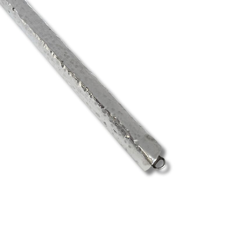 Side profile of hammered sterling silver Yad with attached silver loop for chain